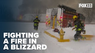 Firefighters fight fire and blizzard at paper converting facility