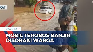 Viral Mobil Disoraki Warga Saat Terobos Banjir di Bandung