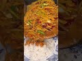 the stage of pouring a cooked dish onto the top of the rice that will be enjoyed immediately#food