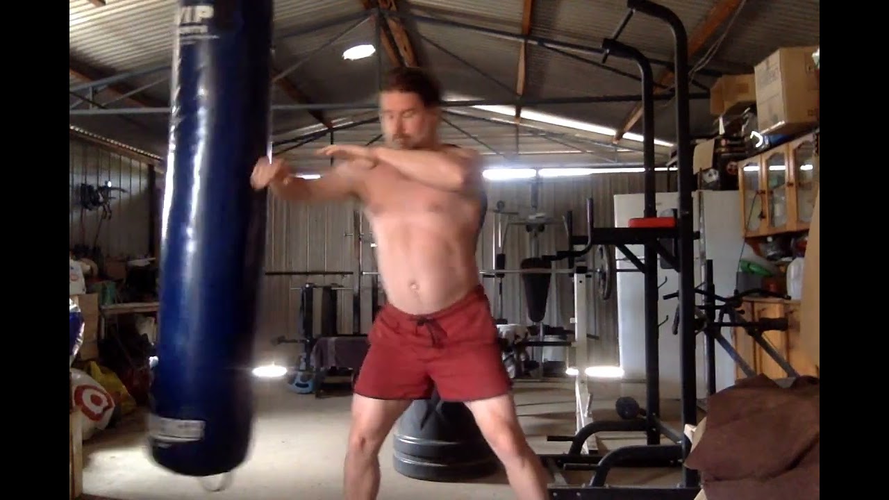 Kangaroo Kungfu elbow striking concepts on boxing bag. 