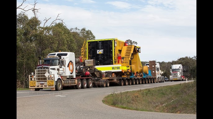 Tri Drive Kenworth Hauling a Komatsu WA1200 - YouTube