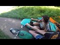 Девушка учится ехать на мотоцикле урал