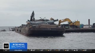 New video shows efforts lifting containers off cargo ship at Key Bridge site