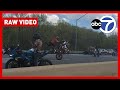 Wheely frustrating! Gang of motorcyclists bring Maryland highway to a standstill as they perform tricks in front of infuriated drivers