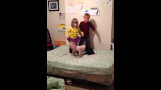 Ben, Avery and Sam jumping on bed