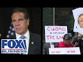 Protests grow outside Cuomo's office after 'stunning' sexual harassment report