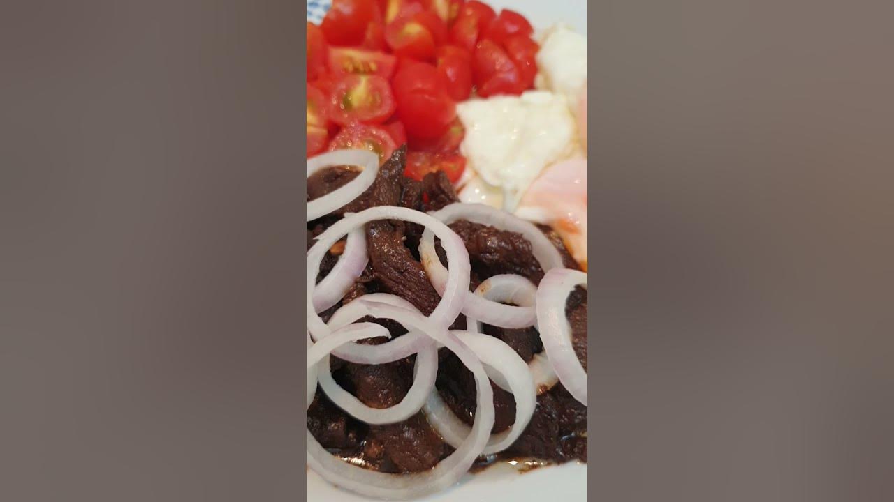 BEEF STEAK BISTEK TAGALOG WITH SUNNYSIDE UP EGGS AND CHERRY TOMATOES