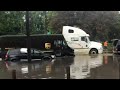 Multiple vehicles stuck flooded roads in Detroit