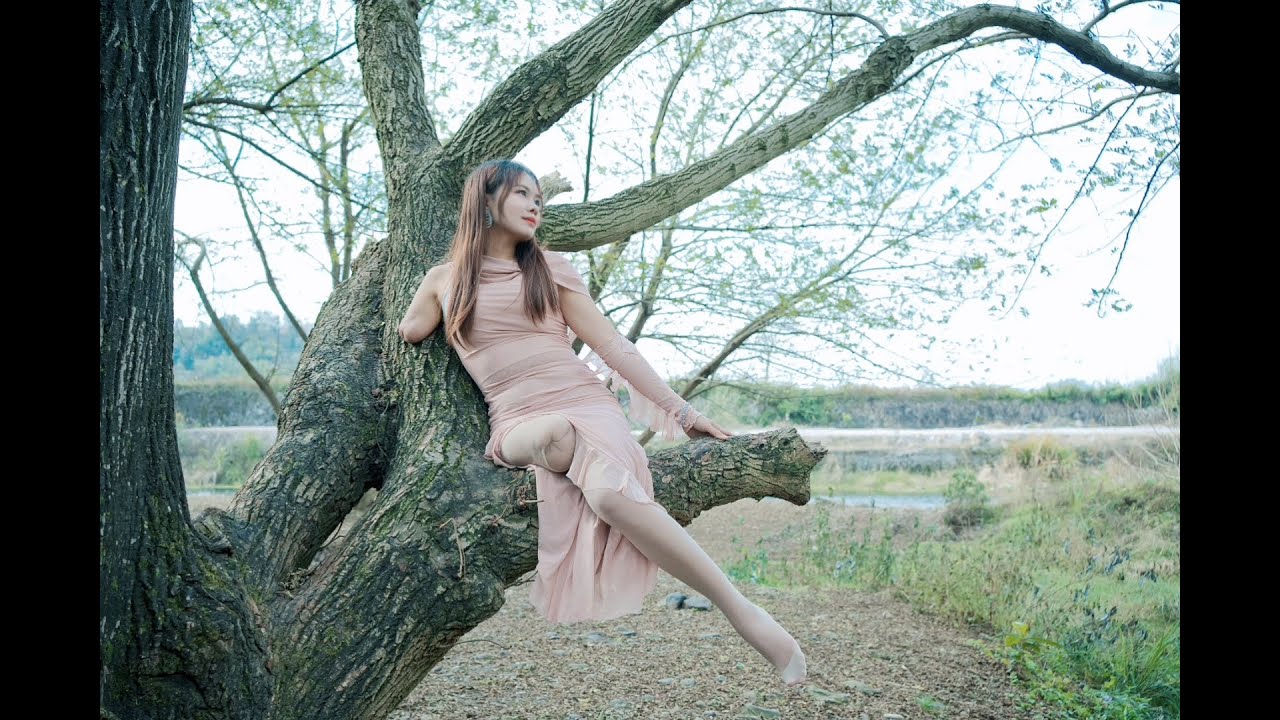 Abby: Ooe Amputee Girl - A girl wearing a pink long dress