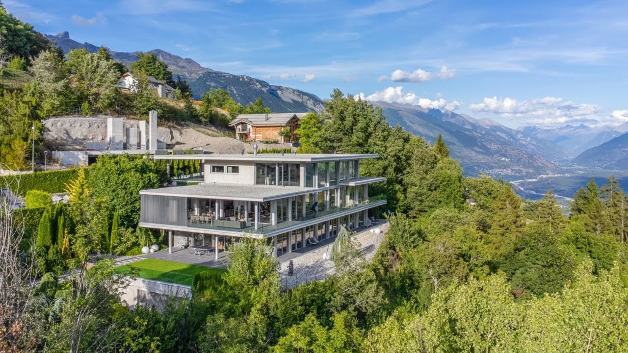 A Swiss Villa with an unobstructed, 180-degree panoramic view of the Swiss Alps