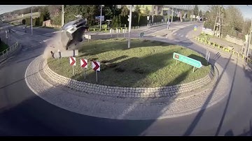 Car takes flight over roundabout in Poland