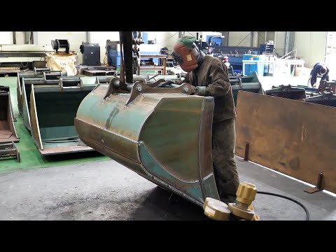 The process of making lightest excavator bucket. Metal processing factory in