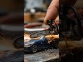 mini chain saw cutting the bmw sports car