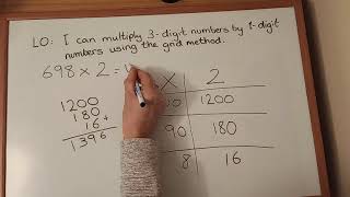 Using the grid method to multiply 3-digit by 2-digit numbers.