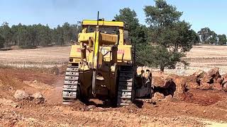 Caterpillar D10 Dozer adjusting some Rock