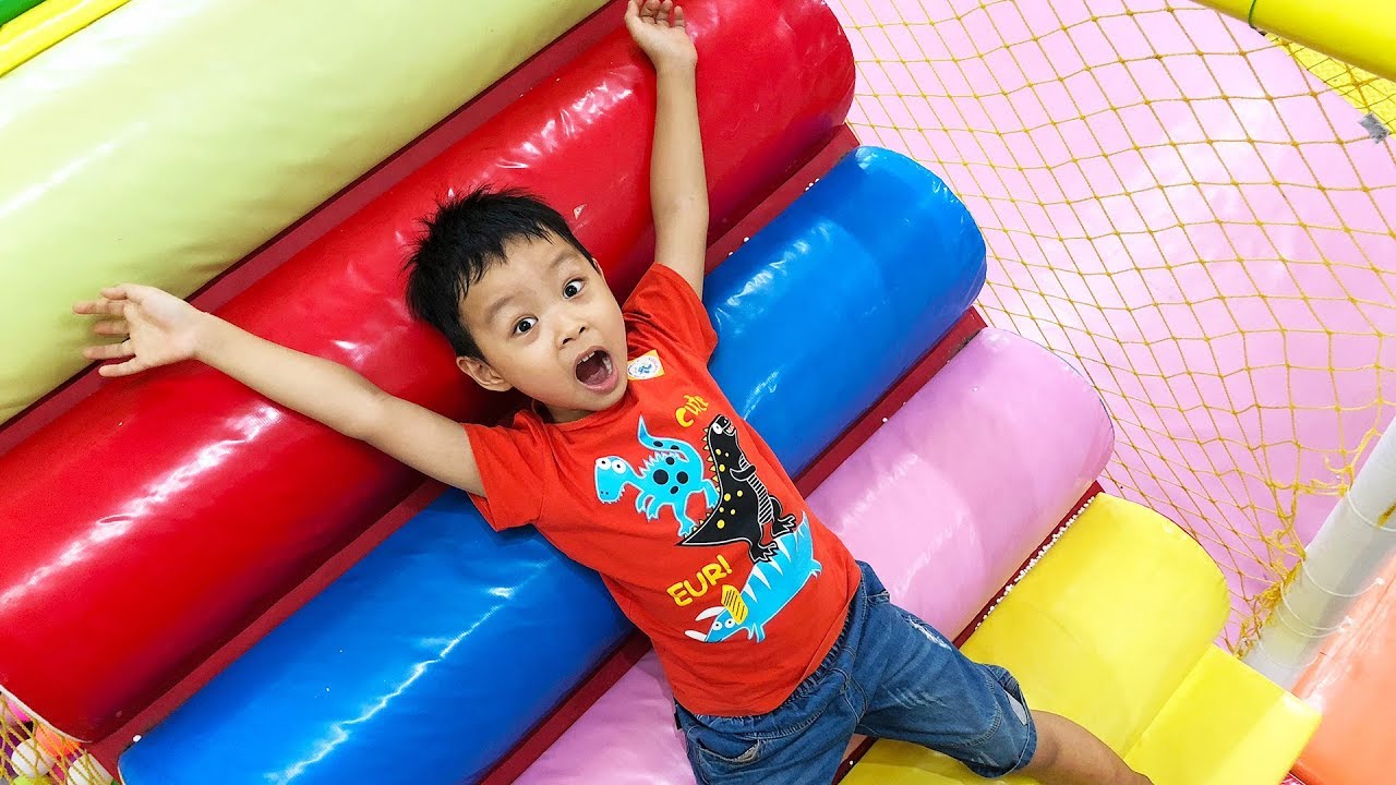 Indoor playground for kids and family fun with big long slide, swing ...