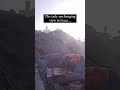 A Gazan man praying on the rubble of a destroyed mosque in Gaza