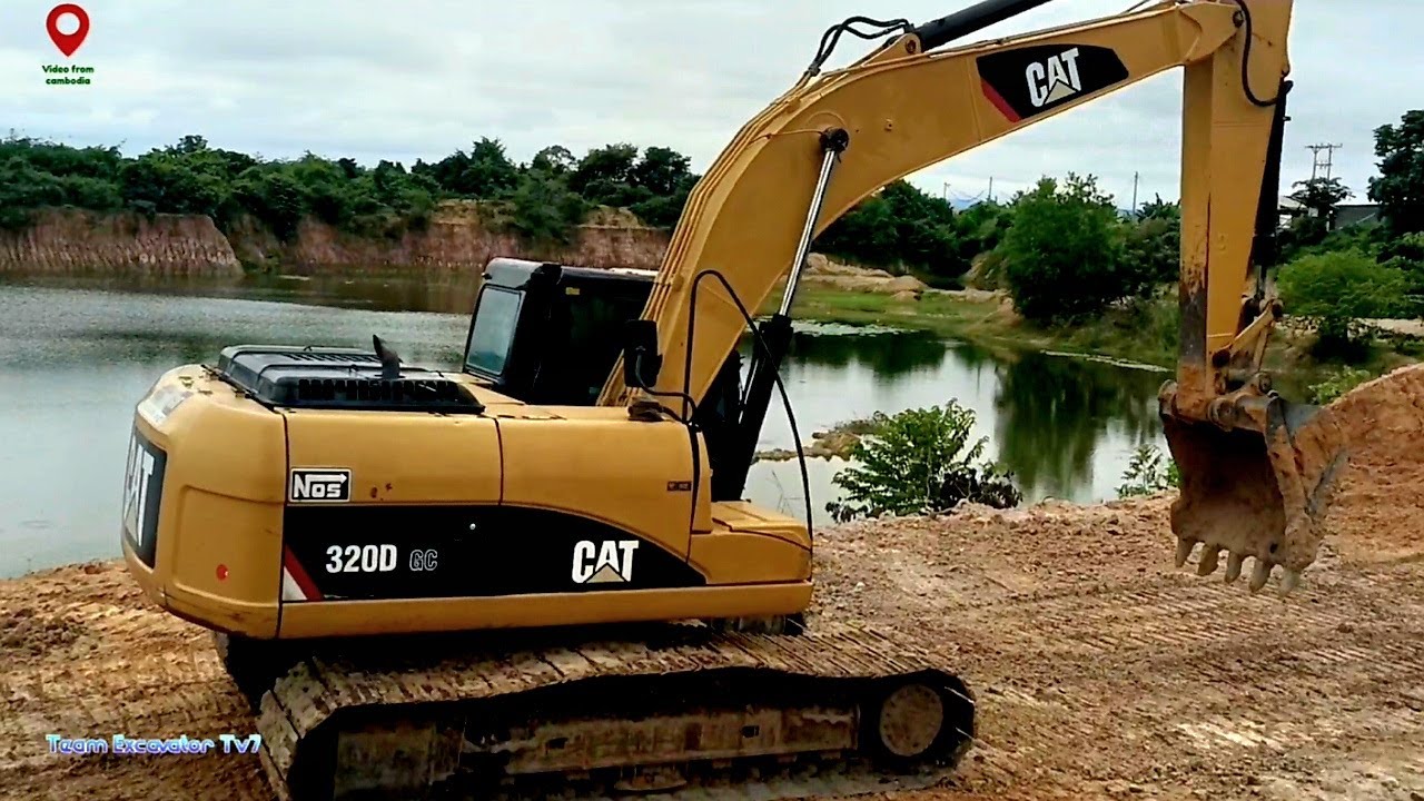 Excavator 320D digging intensely, transforming into a massive lake ...