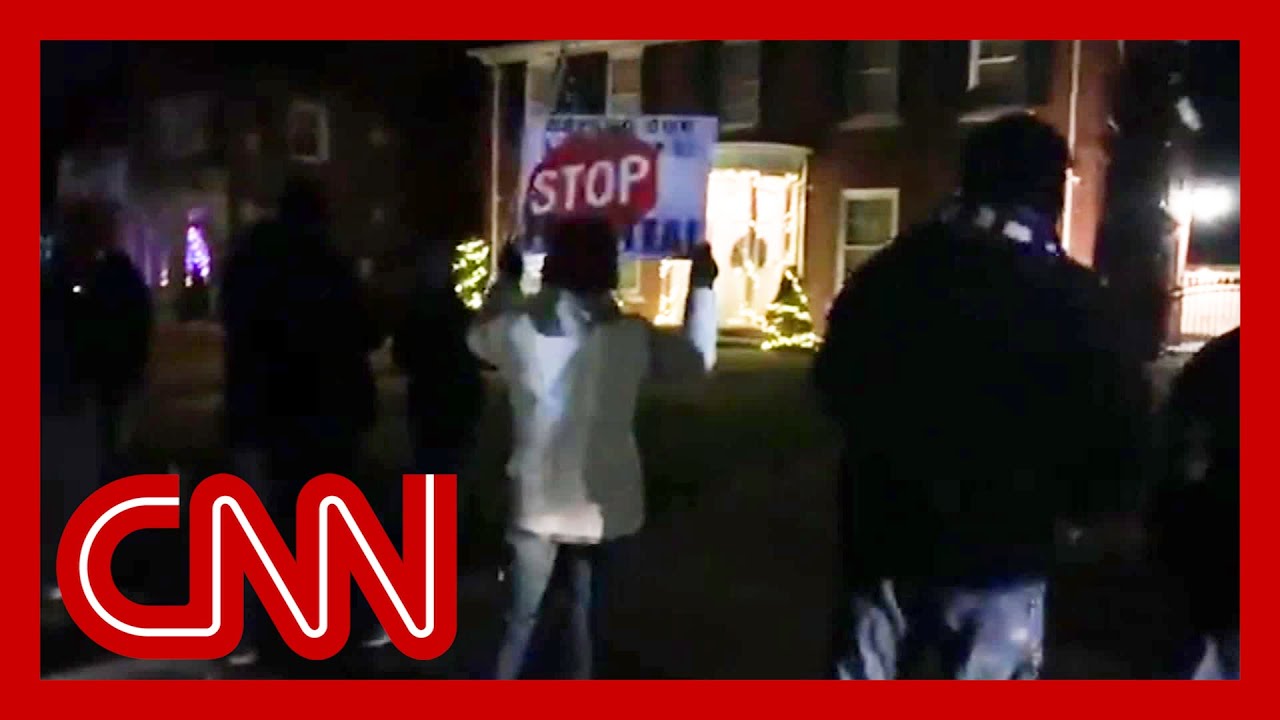 See Trump supporters protest outside Michigan official's house