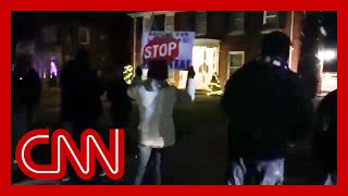 See Trump supporters protest outside Michigan official's house