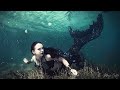 Gothic mermaid with black mermaid tail swimming underwater  the magic crafter