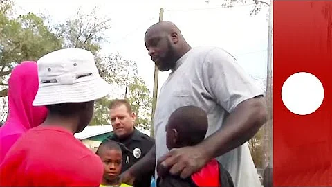 Shaquille O'Neal joins in street basketball game with cops & kids