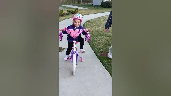Isabella riding her bike with Daddy :)