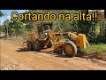 Limpeza das ruas. Motoniveladora patrola caterpillar 120K / Grader niveleuse motoconformadora