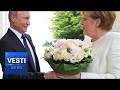 SCANDAL: German Media SHOCKED That Putin Offered Merkel Flowers Instead of Handshake