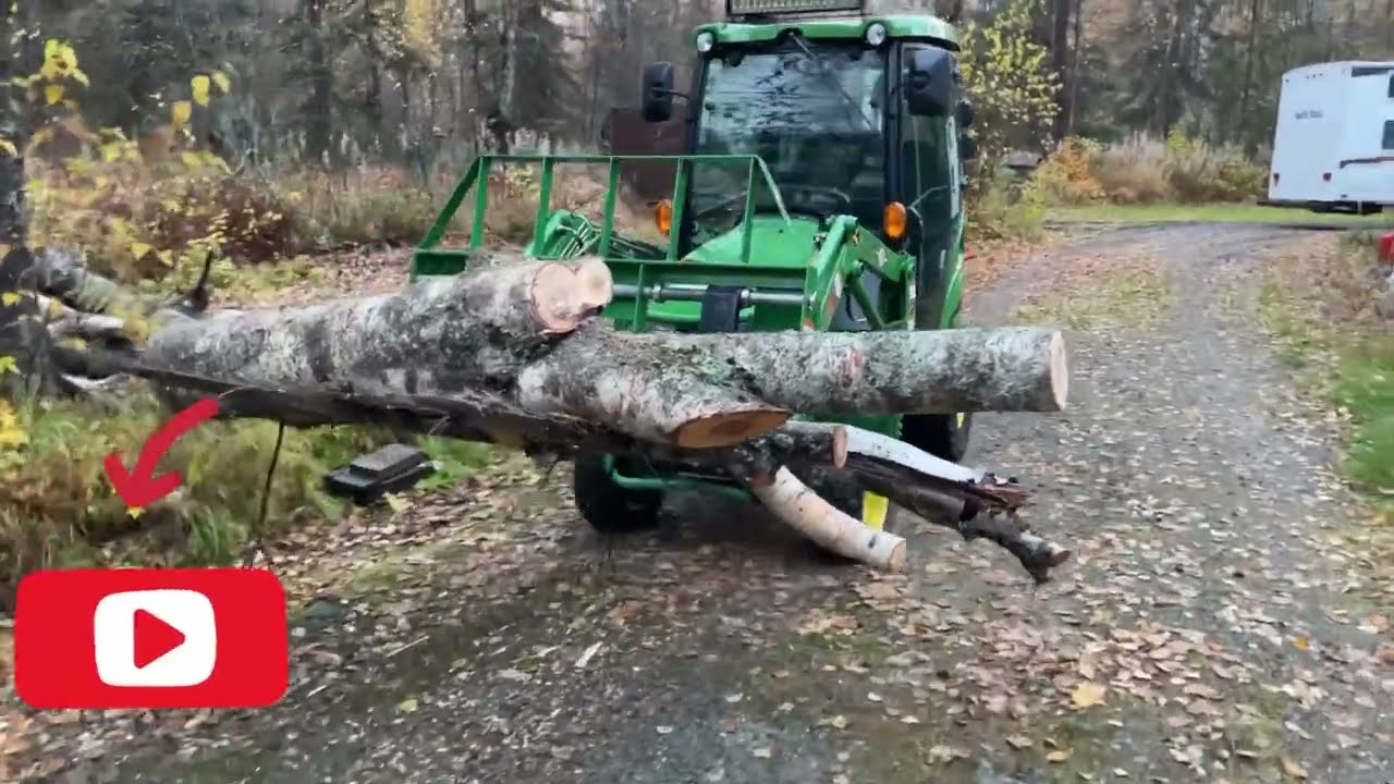 John Deere 1025R and pallet forks! Removing and stacking trees for