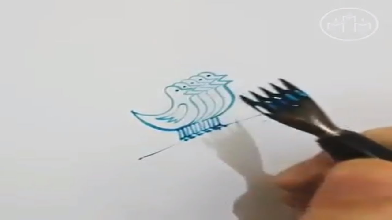 Calligraphy artist Tolga Girgin drwas multiple birds and faces