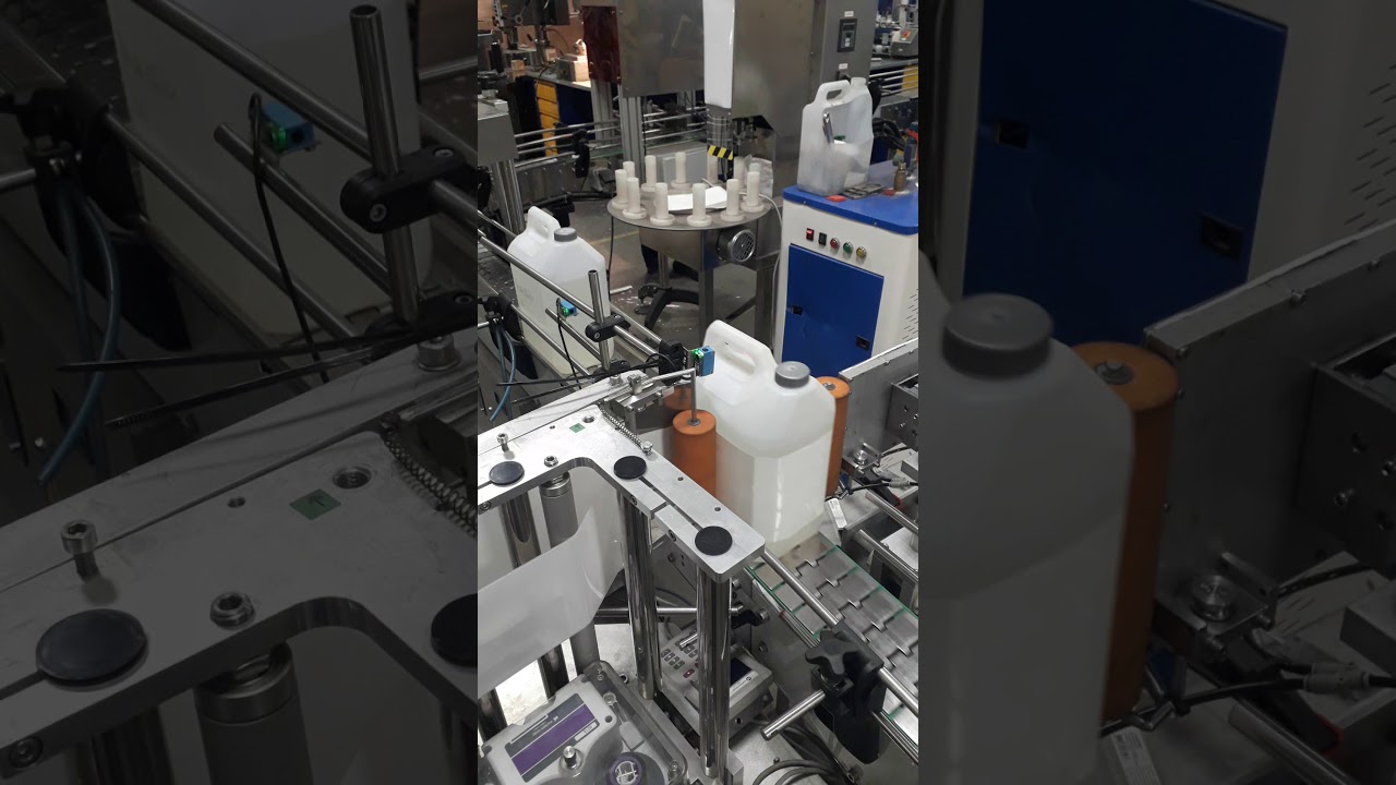 Автоматическая этикетировочная линия АЭ-5 с системой трехсторонней этикетировки канистр.