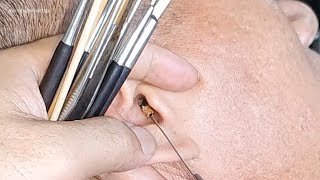 Ear wax removing relaxing with barber shop
