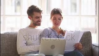 Stock Footage Happy Positive Young Couple Holding Reading Good News In Document Letter Smiling Famil