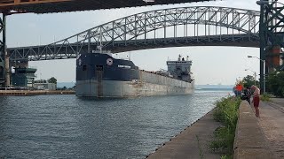 MASSIVE Great lakes freighter goes through Burlington canal, under lift bridge.