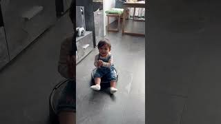 Baby's Joyful Ride on a Robot Vacuum Cleaner