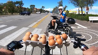 ANGRY CYCLIST throws eggs at the outlaw biker STUPID