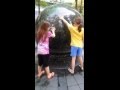 Twin girls pushing giant rock cause they are super heroes cantonese speakers