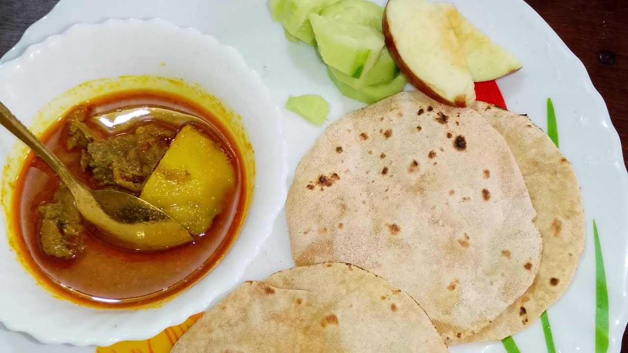 # lunch today=== garam masala chicken with alu + roti+ salad+ apple..== magical taste.