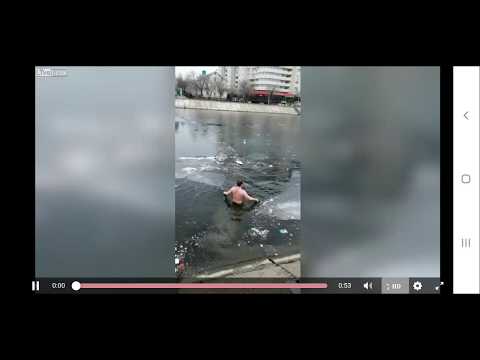 Dog Rescue - Russian Man Jumps in Icy River To Save Drowning Dog