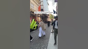 E-bike thief steals a phone from a man filming a Lamborghini in posh London.