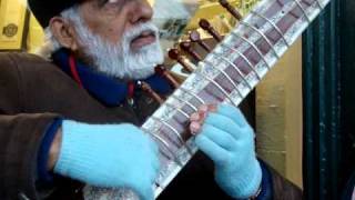 Sitar (hindu guitar) player...