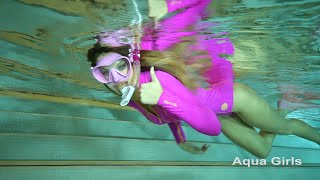 Pink bodysuit snorkeling girl
