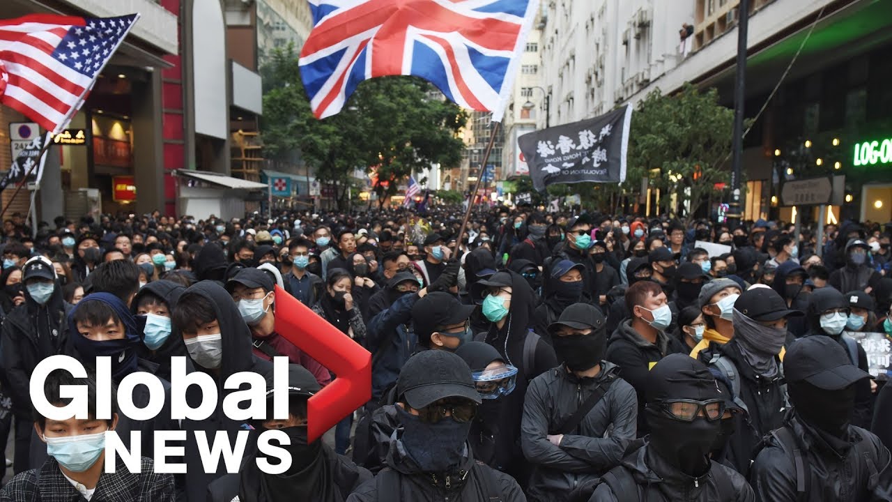 Hong Kong protesters take part in rally as government urges calm