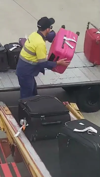 How airport baggage handlers handle your baggage