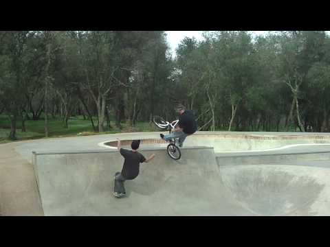 skater tries to tailslide under biker airing over him. filmed march 6th 2010 ione skatepark california bmx skate fall