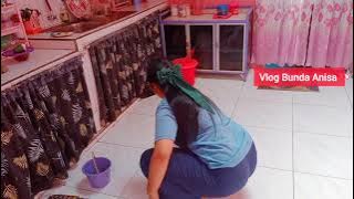 Mom's morning activities washing dishes and sweeping the kitchen floor