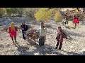 Breaking firewood in a dangerous place and pulling it down with a rope