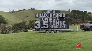 Just a video of a Hilux Hybrid towing a 3.5 tonne headline in a paddock | Toyota New Zealand