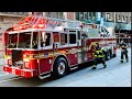 FDNY LADDER 25 RESPONDING FROM QUARTERS ON WEST 77TH STREET ON WEST SIDE OF MANHATTAN, NEW YORK CITY